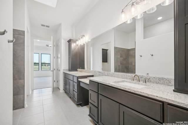 bathroom featuring ceiling fan, vanity, and tile patterned flooring