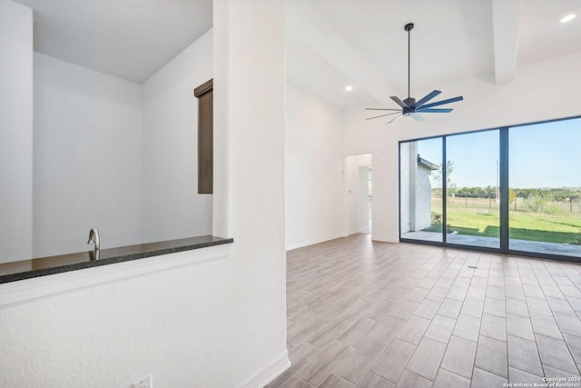 23422 Grande Vis, San Antonio, TX 78261 - unfurnished room featuring baseboards, ceiling fan, light wood-style floors, beamed ceiling, and recessed lighting