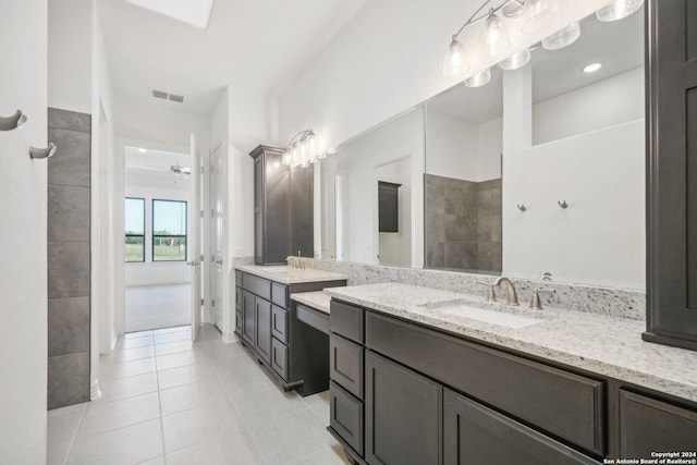 bathroom featuring vanity, tile patterned floors, and ceiling fan