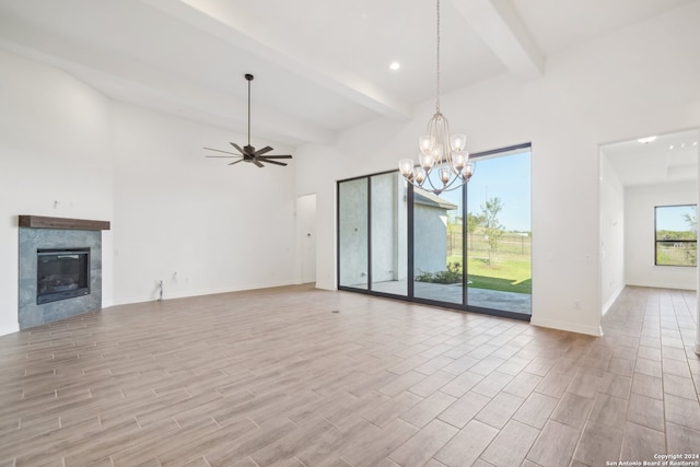 unfurnished living room with ceiling fan with notable chandelier, a fireplace, and beamed ceiling