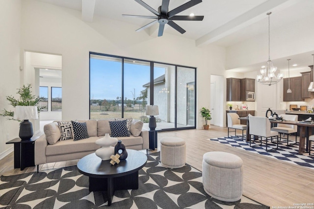 23422 Grande Vis, San Antonio, TX 78261 - living room featuring a chandelier, beamed ceiling, light wood finished floors, a towering ceiling, and ceiling fan