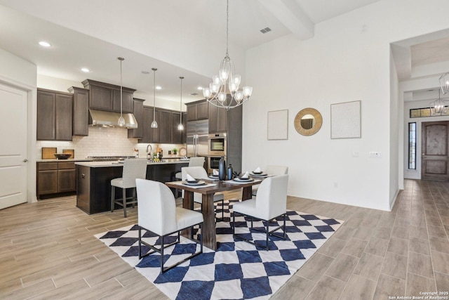 23422 Grande Vis, San Antonio, TX 78261 - dining area featuring a chandelier, light wood-style flooring, recessed lighting, beamed ceiling, and baseboards