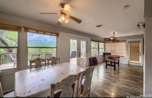 dining space with french doors, ceiling fan, and dark wood-type flooring