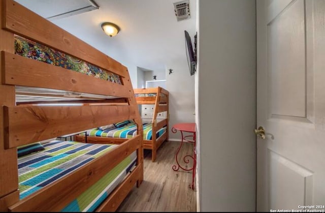 bedroom with light hardwood / wood-style flooring