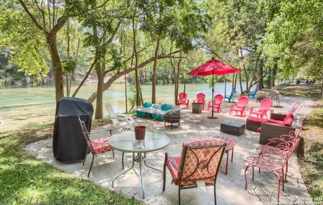 view of patio / terrace featuring a fire pit and grilling area