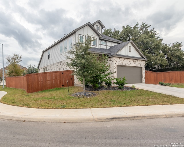 view of front facade featuring a front yard and a garage