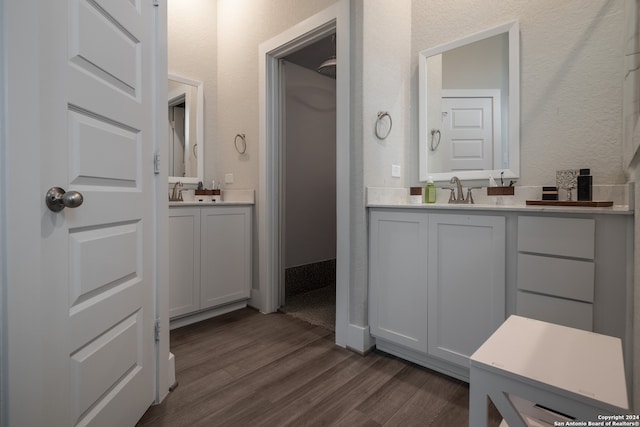 bathroom featuring vanity and hardwood / wood-style flooring