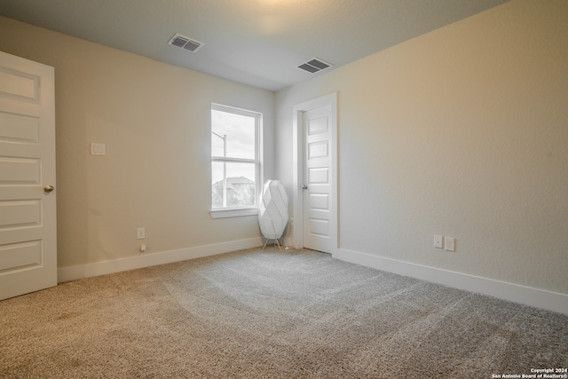 empty room featuring carpet flooring