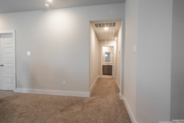 hallway with light colored carpet