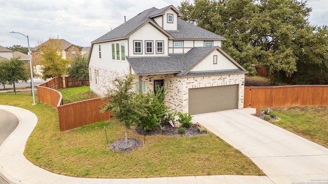 view of front facade with a front yard and a garage