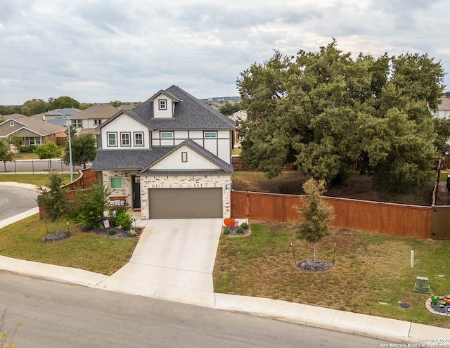 view of front facade featuring a front yard and a garage