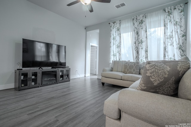 living room featuring hardwood / wood-style flooring and ceiling fan