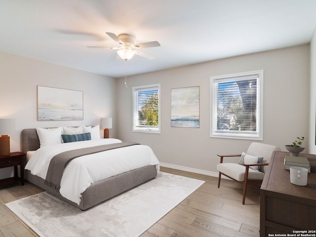 bedroom featuring light hardwood / wood-style flooring and ceiling fan