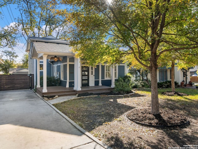 obstructed view of property featuring ceiling fan and covered porch