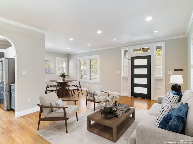 132 Argo Ave, Alamo Heights, TX 78209 - living room featuring crown molding, arched walkways, light wood-type flooring, and recessed lighting