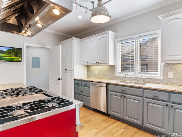 kitchen with island exhaust hood, appliances with stainless steel finishes, tasteful backsplash, sink, and white cabinets