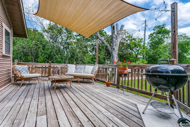 deck featuring a grill