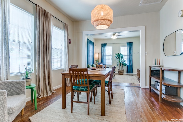 dining space featuring hardwood / wood-style flooring and ceiling fan