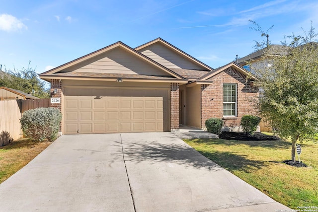 single story home with a garage and a front lawn