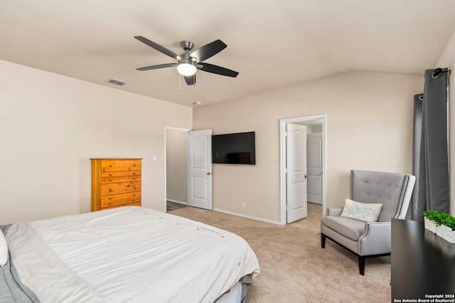 carpeted bedroom with ceiling fan and vaulted ceiling