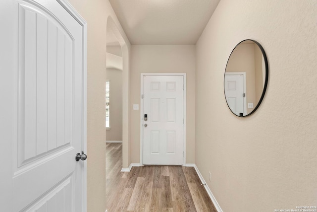 doorway to outside with light hardwood / wood-style flooring