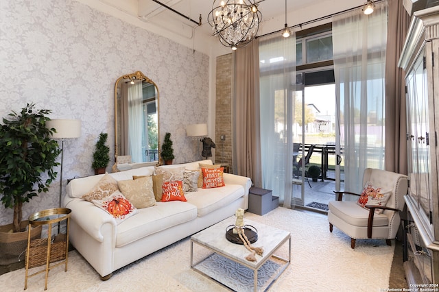 living room with a healthy amount of sunlight and a notable chandelier