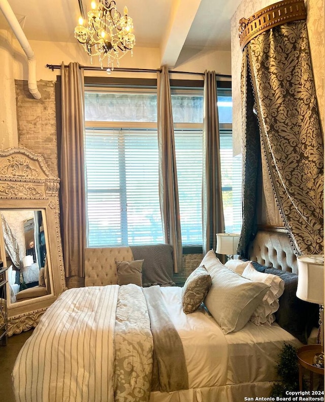 bedroom featuring a chandelier and beam ceiling