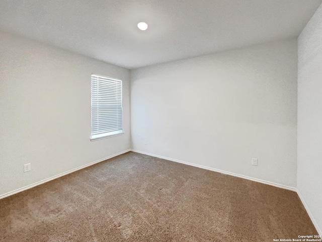 7502 Hercules Pt, San Antonio, TX 78252 - carpeted empty room with baseboards