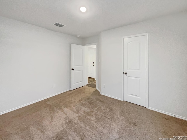 7502 Hercules Pt, San Antonio, TX 78252 - unfurnished bedroom with carpet flooring and baseboards