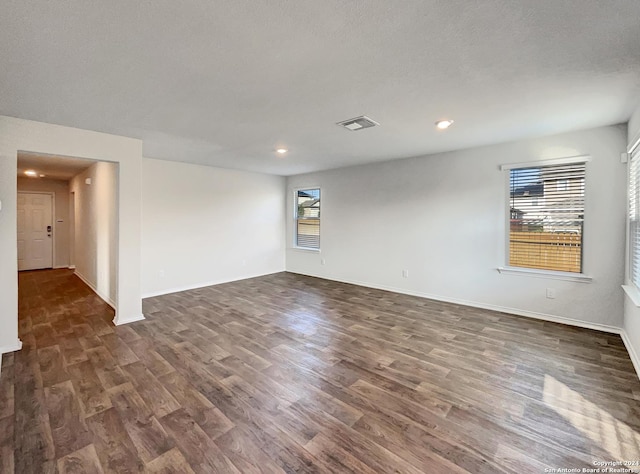 7502 Hercules Pt, San Antonio, TX 78252 - spare room featuring dark wood finished floors, recessed lighting, and baseboards