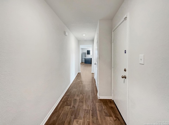 7502 Hercules Pt, San Antonio, TX 78252 - hallway featuring dark wood-type flooring and baseboards
