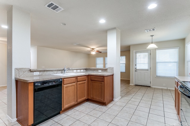 kitchen with ceiling fan, sink, decorative light fixtures, light tile patterned flooring, and black appliances