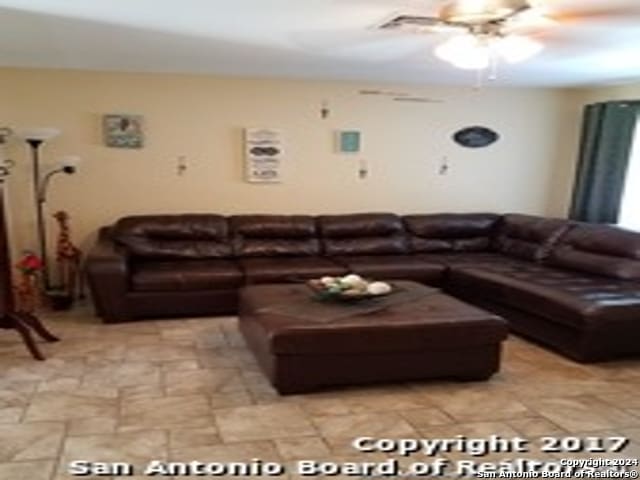 living room featuring ceiling fan