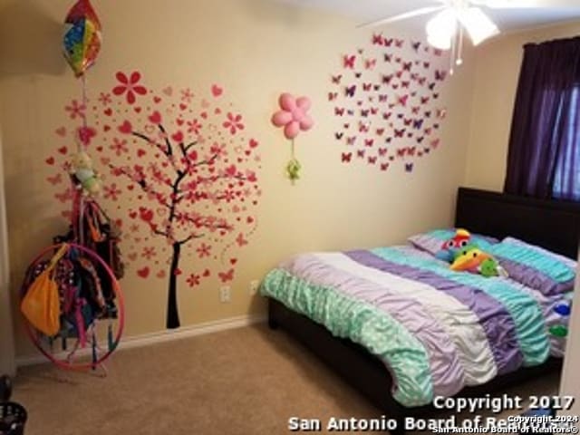 carpeted bedroom with ceiling fan