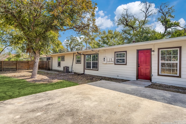 single story home featuring central air condition unit