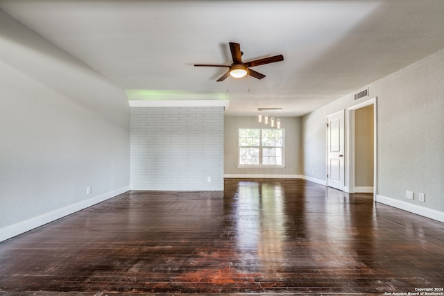 unfurnished room featuring dark hardwood / wood-style floors and ceiling fan