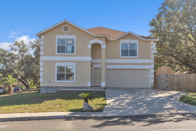 front of property featuring a front yard and a garage