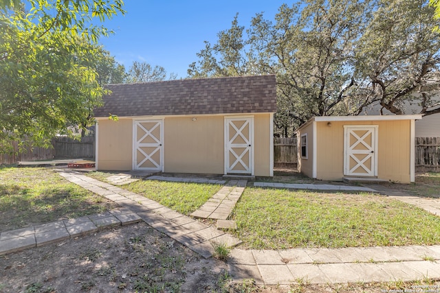 view of outdoor structure with a lawn