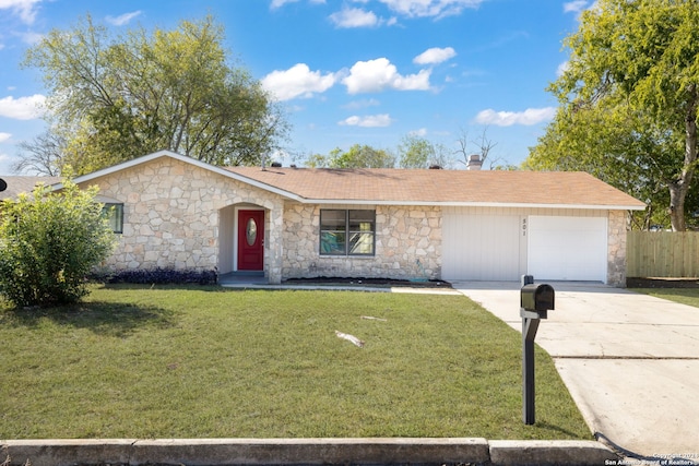 single story home featuring a garage and a front lawn