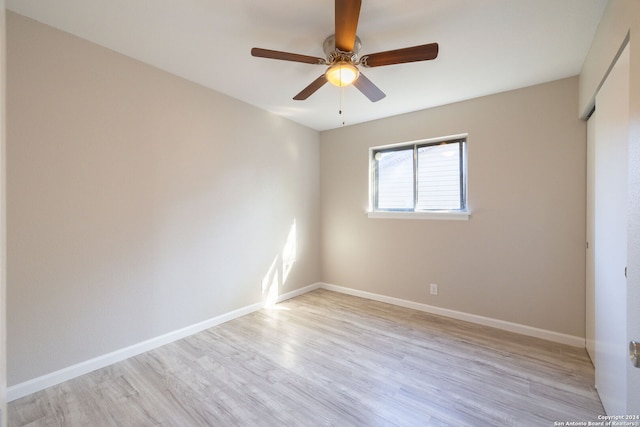 empty room featuring ceiling fan and light hardwood / wood-style floors