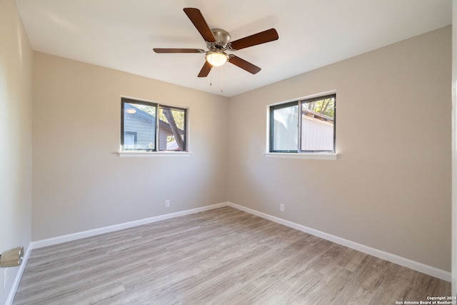 spare room featuring ceiling fan and light wood-type flooring