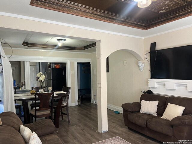 615 Carolina St, San Antonio, TX 78210 - living area with arched walkways, a tray ceiling, dark wood finished floors, and crown molding