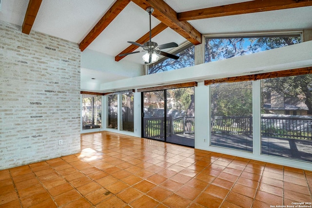 unfurnished sunroom with vaulted ceiling with beams and ceiling fan