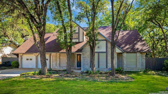 view of front facade with a front lawn and a garage