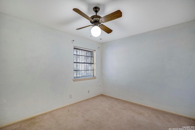 carpeted empty room with ceiling fan