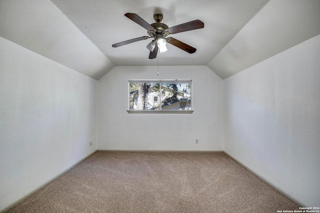 bonus room featuring carpet, ceiling fan, a textured ceiling, and vaulted ceiling