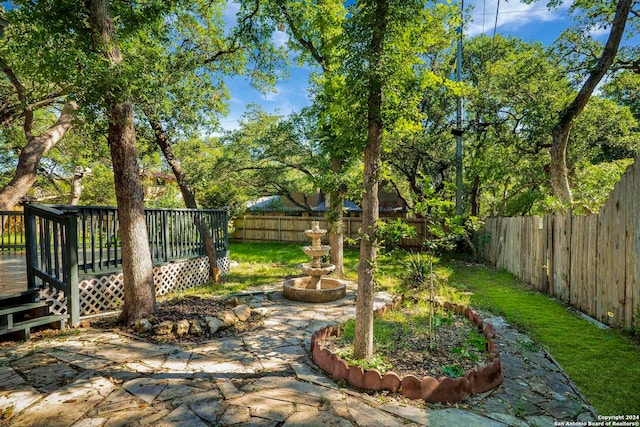 view of yard with a deck and a patio area