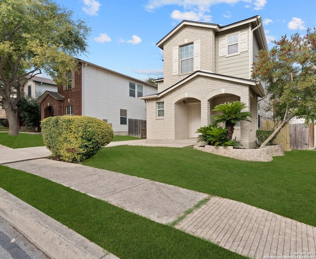 view of property with a front lawn