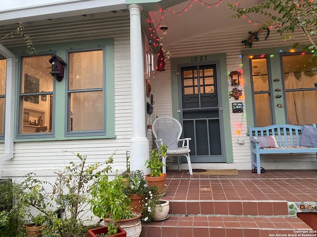 doorway to property featuring a porch