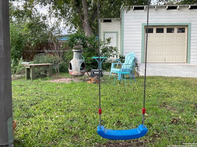 view of yard with a garage